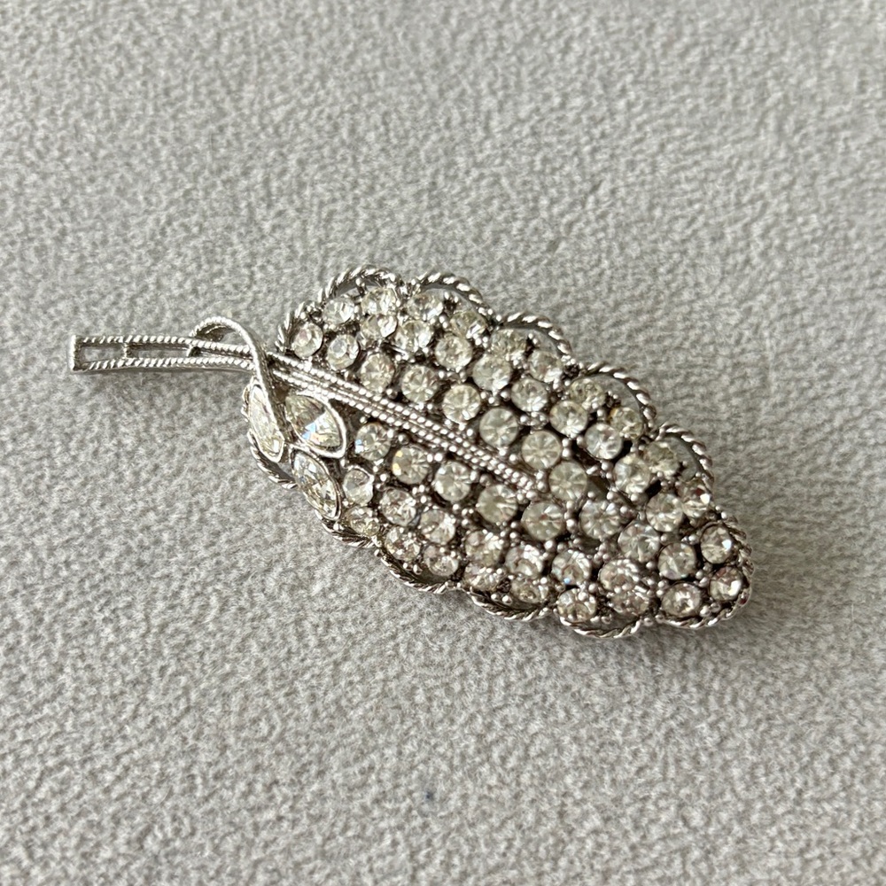 Silver tone and rhinestone leaf pin brooch